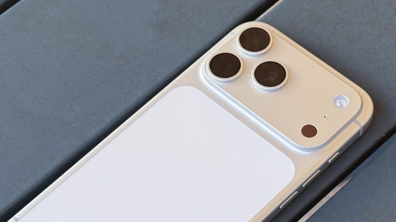 Detailed view of the rear camera module on a professional iPhone model.