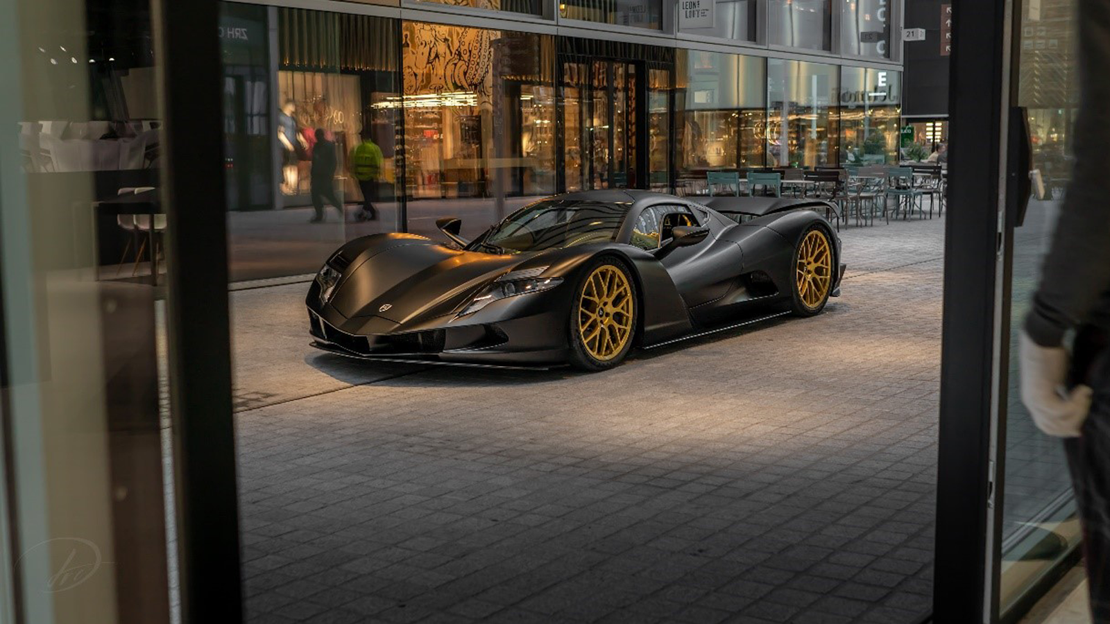 White Aspark Owl electric hypercar in a profile view.