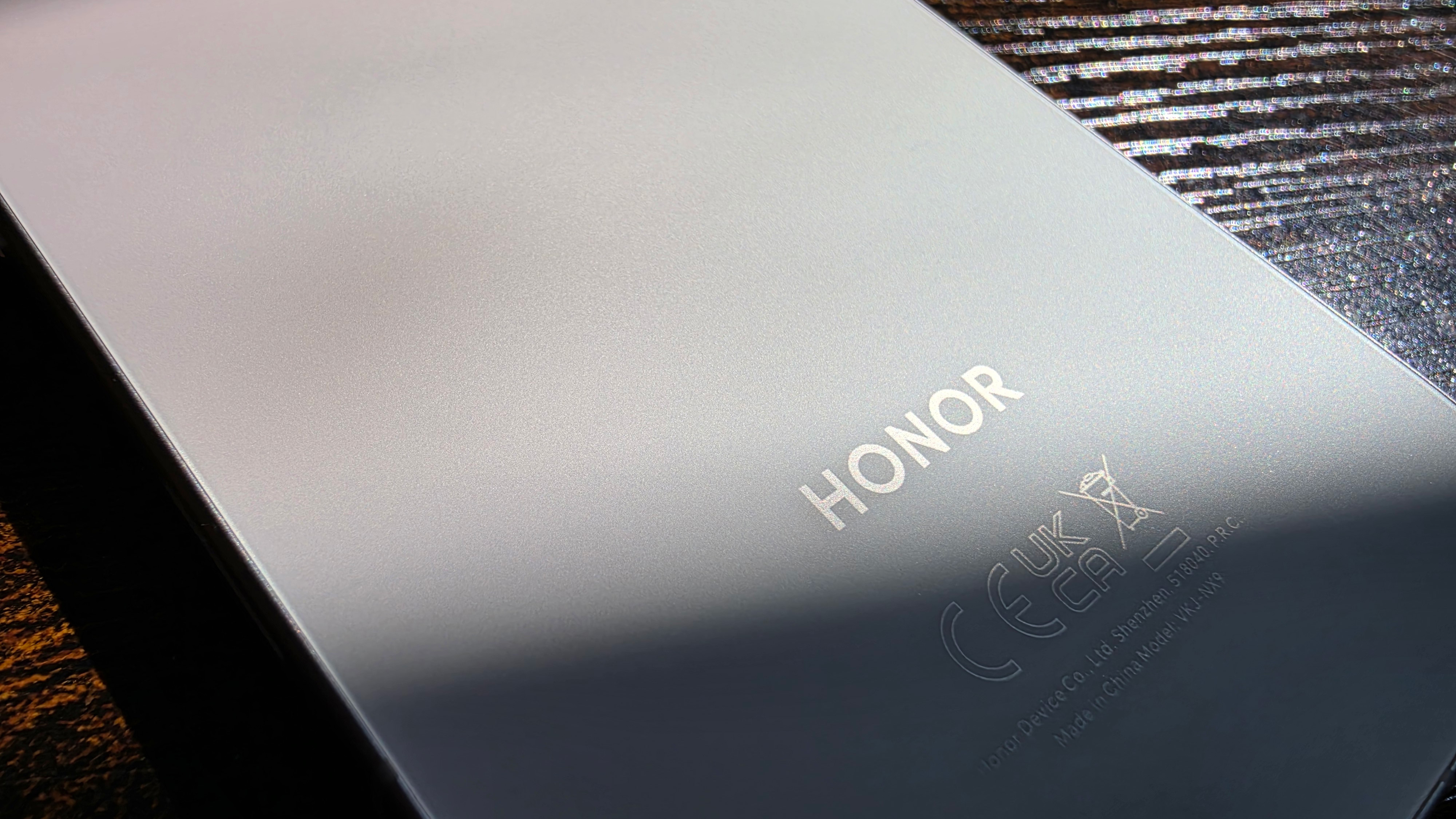The Honor 600 smartphone with its bright AMOLED screen turned on.