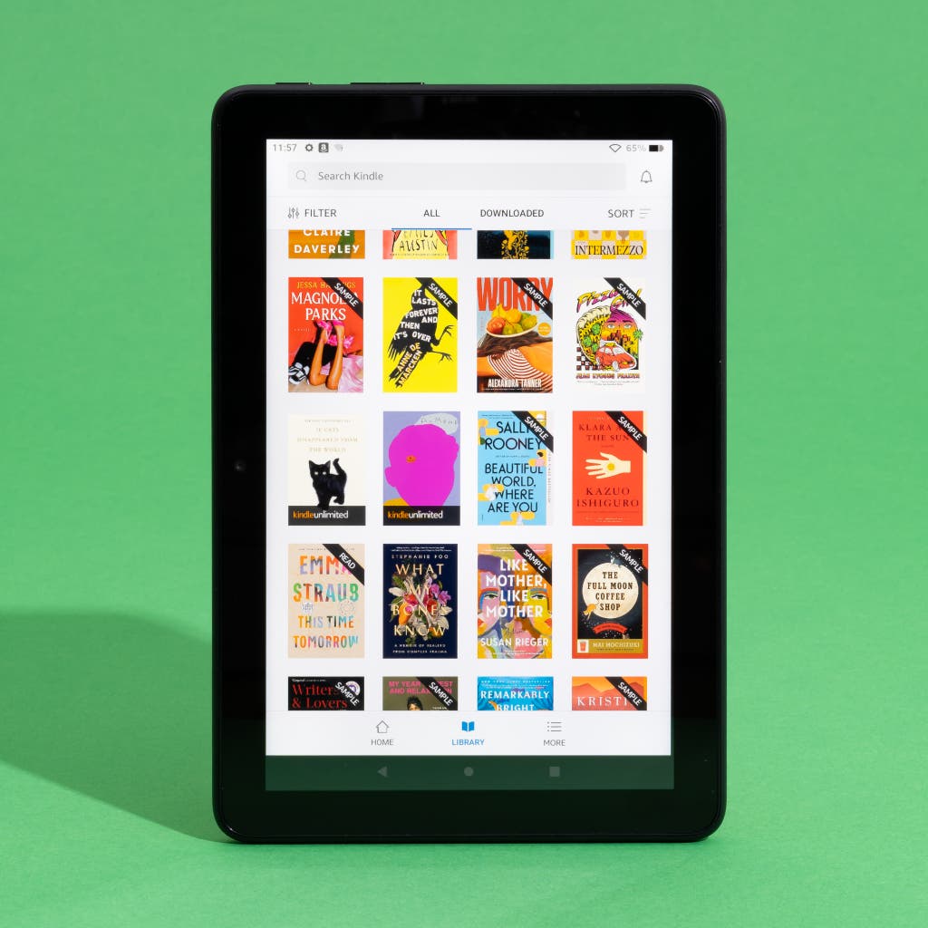 An Amazon Fire HD 8 tablet showing a library of Kindle ebooks.