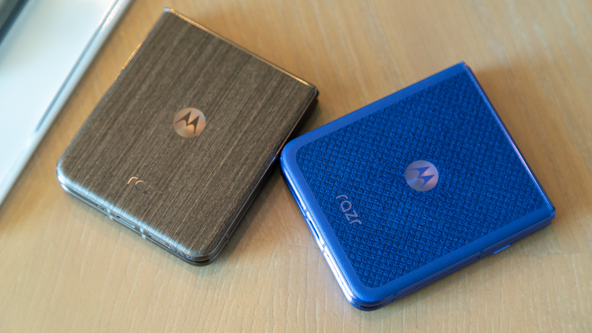 Close-up of the Motorola Razr Ultra 2026 showcasing Alcantara and wood-textured finishes