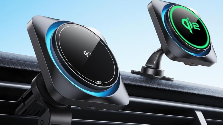 Two ESR Qi2 CryoBoost car mounts attached to a vehicle's dashboard and air vent.