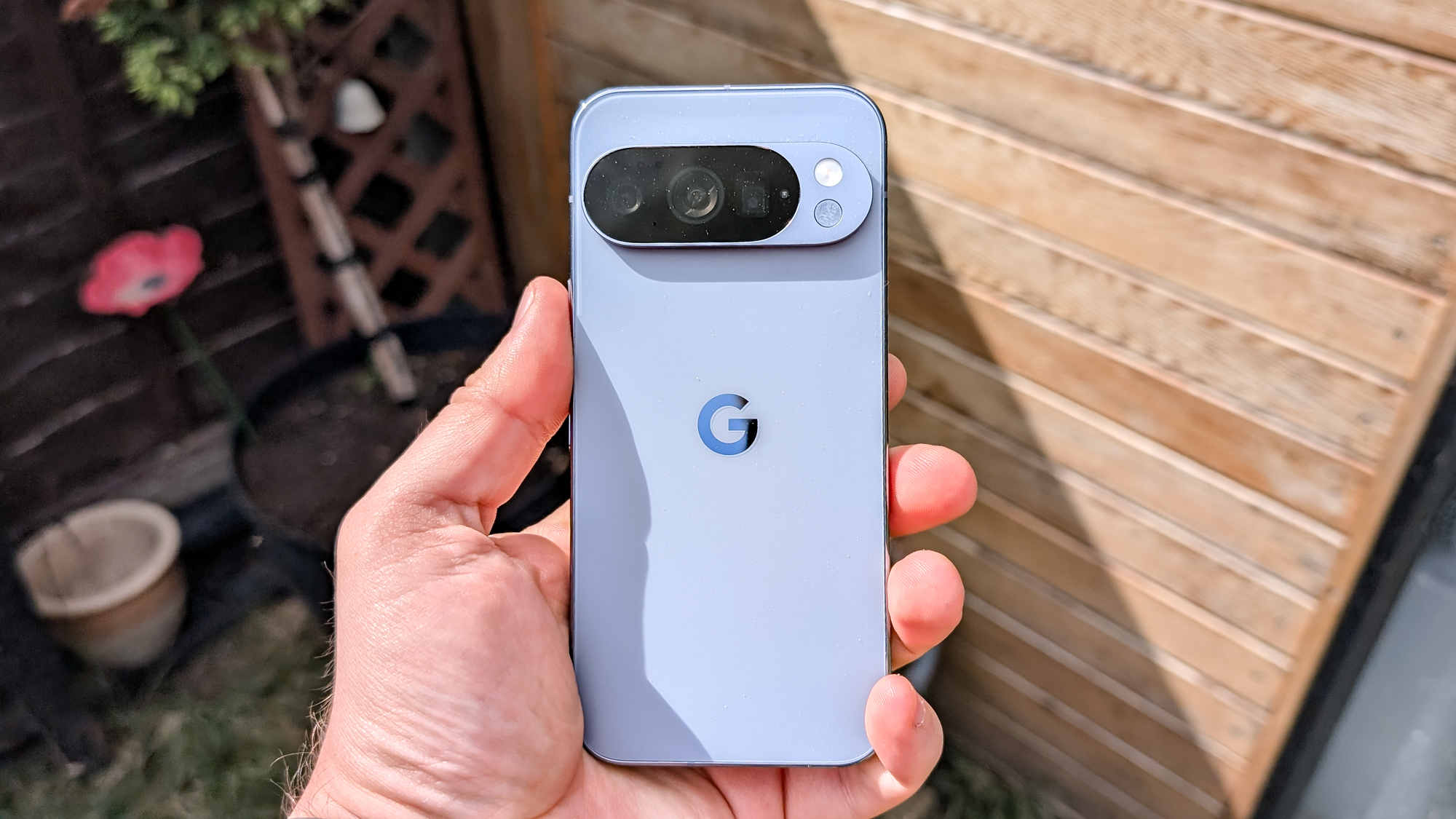 Google Pixel 10 Pro in Moonstone color, showing its rear camera bar and sleek finish.
