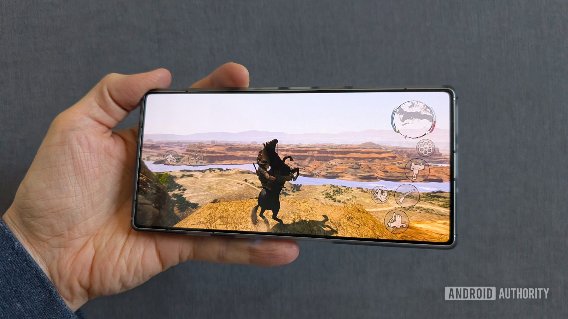 A close-up of a high-end mobile device running a graphically demanding console-style game.
