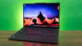 Side profile of a black Lenovo ThinkPad X1 Carbon Gen 13 laptop.