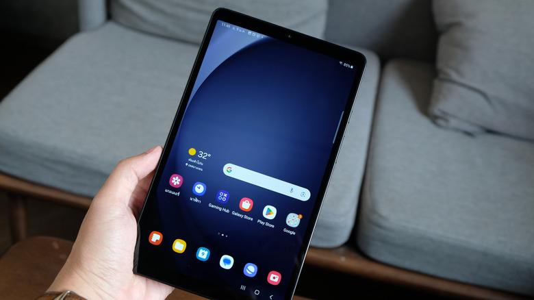 A person holding a Samsung Galaxy Tab A9.