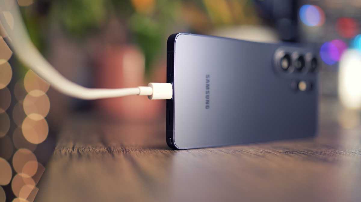 Samsung Galaxy S26 Ultra resting on a flat surface showing its sleek back profile.
