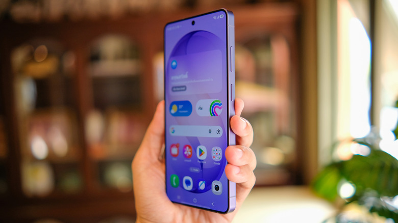 A person holding the large-screen Samsung Galaxy S26 Ultra showing its premium metallic finish.