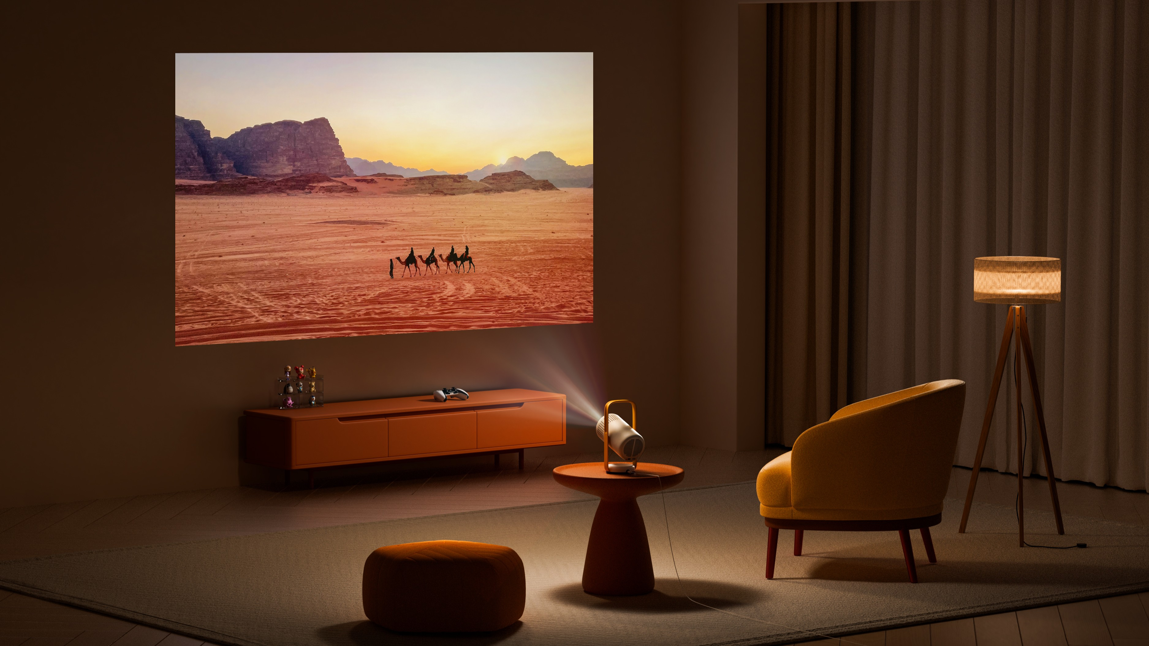 XGIMI Vibe One projecting a vibrant image of camels in a desert onto a white wall.