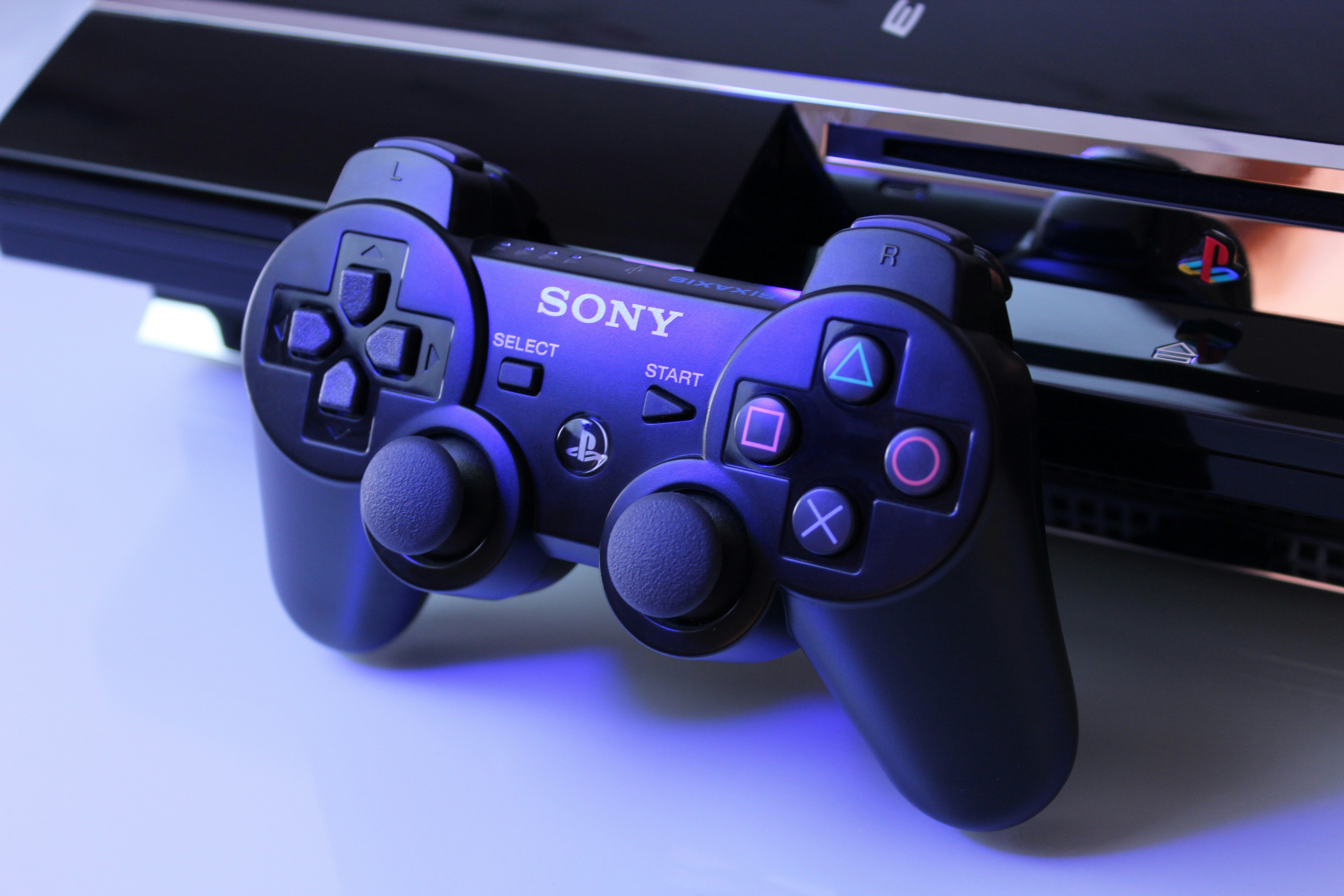 Retro gaming console with a wired controller.