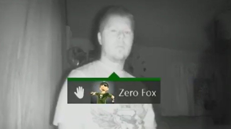 A green-tinted night vision screen showing a stick-figure skeleton overlaying a dark room, typical of ghost hunting software.