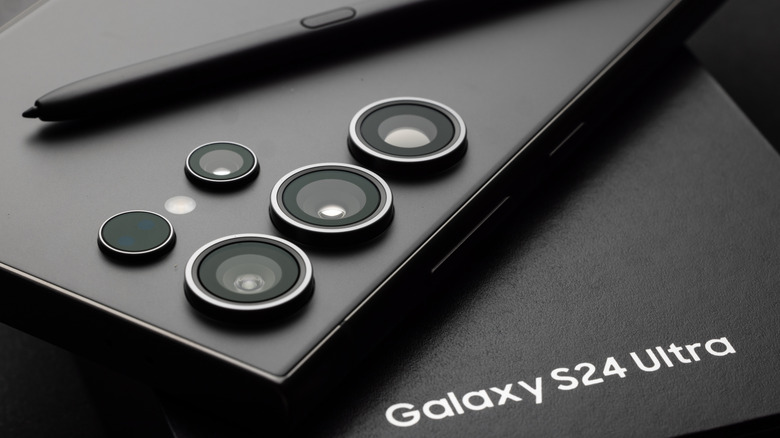 Samsung Galaxy S24 Ultra featuring the S Pen resting on its original packaging.