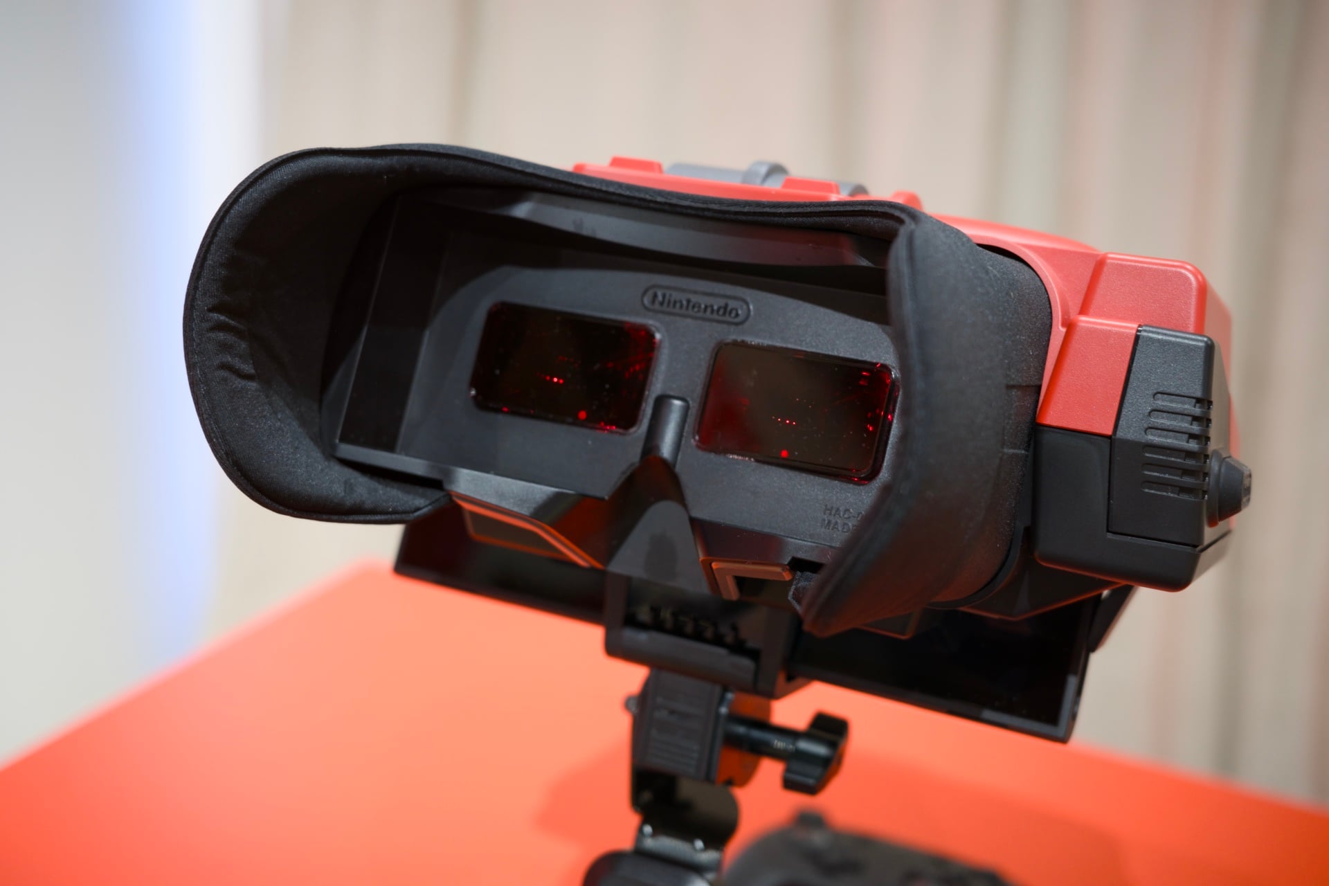 A close-up of the red Nintendo Virtual Boy recreation headset for the Switch 2.