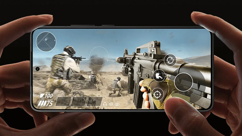 The Poco F7 Pro displaying a fast-paced military shooter game on its screen.
