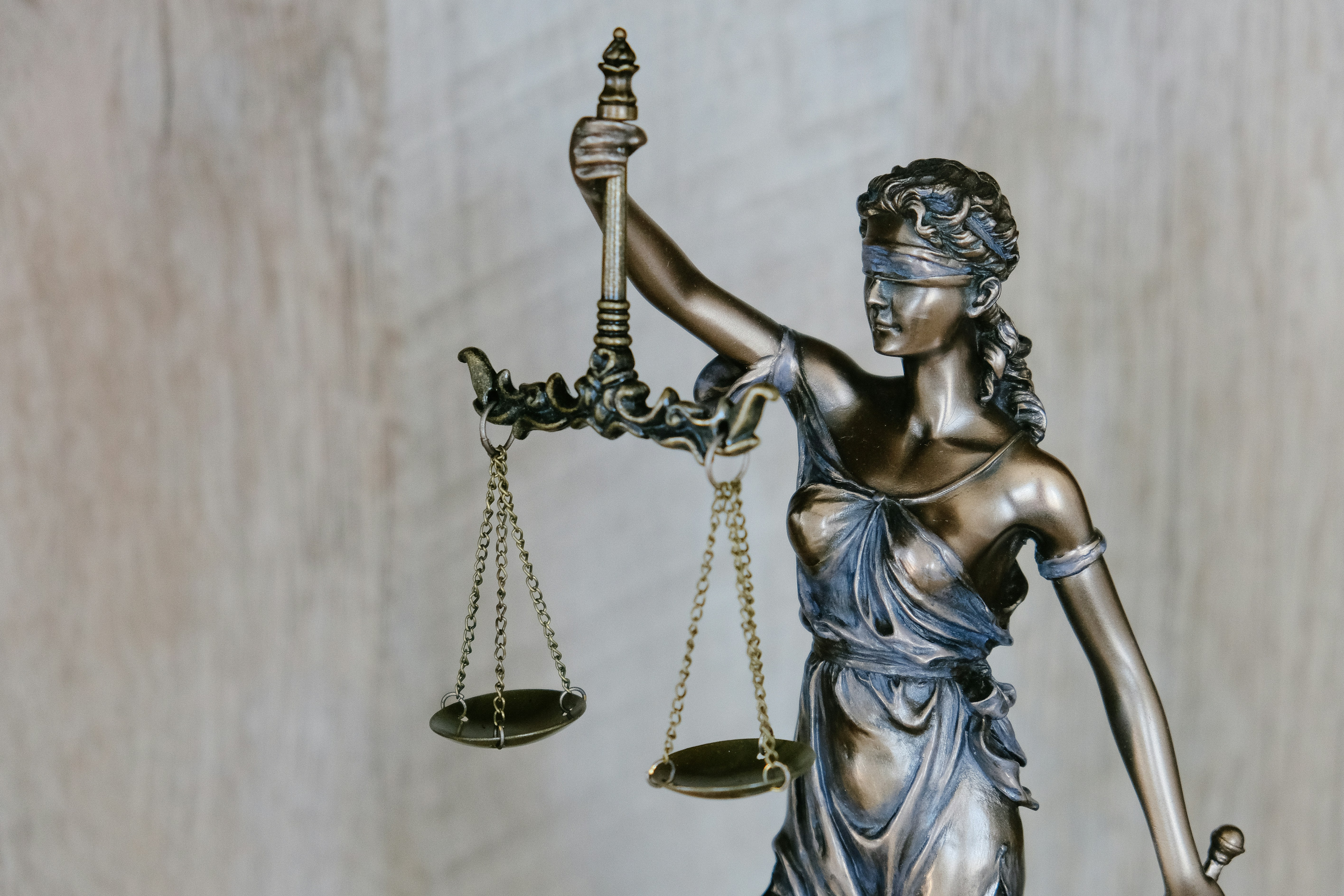 A judicial gavel on a wooden desk representing law and justice.
