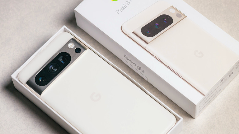 A modern Google Pixel smartphone resting on a neutral tabletop surface.