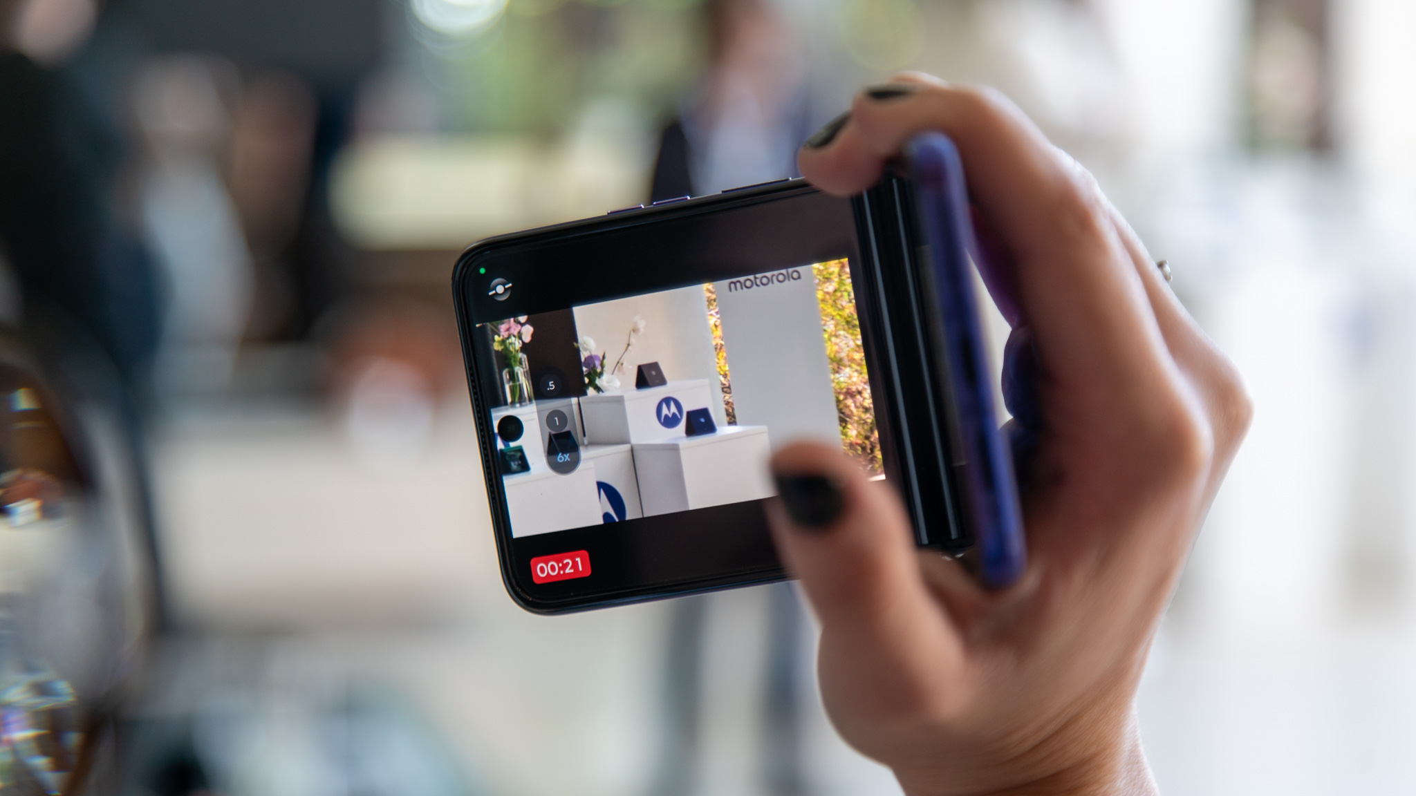 The Motorola Razr Ultra 2026 being used in a partially folded camcorder mode for video recording.