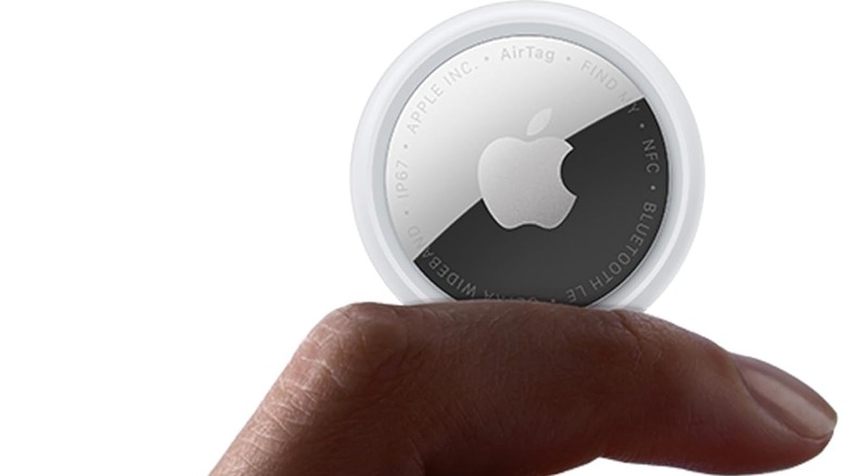 AirTag Gen 2 being held up in a person's hand.