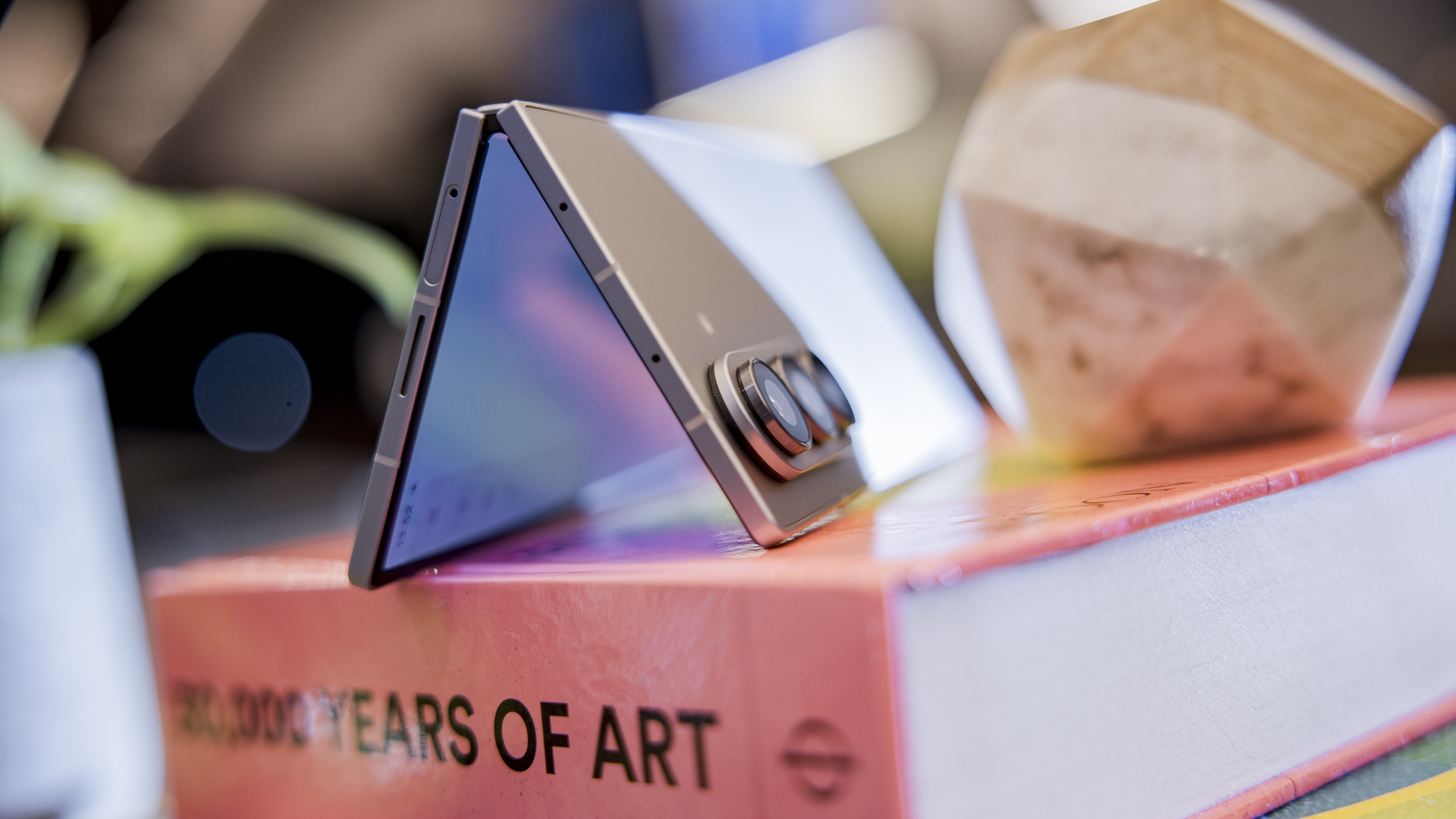 A Samsung Galaxy Z Fold 7 smartphone shown in its partially folded state.