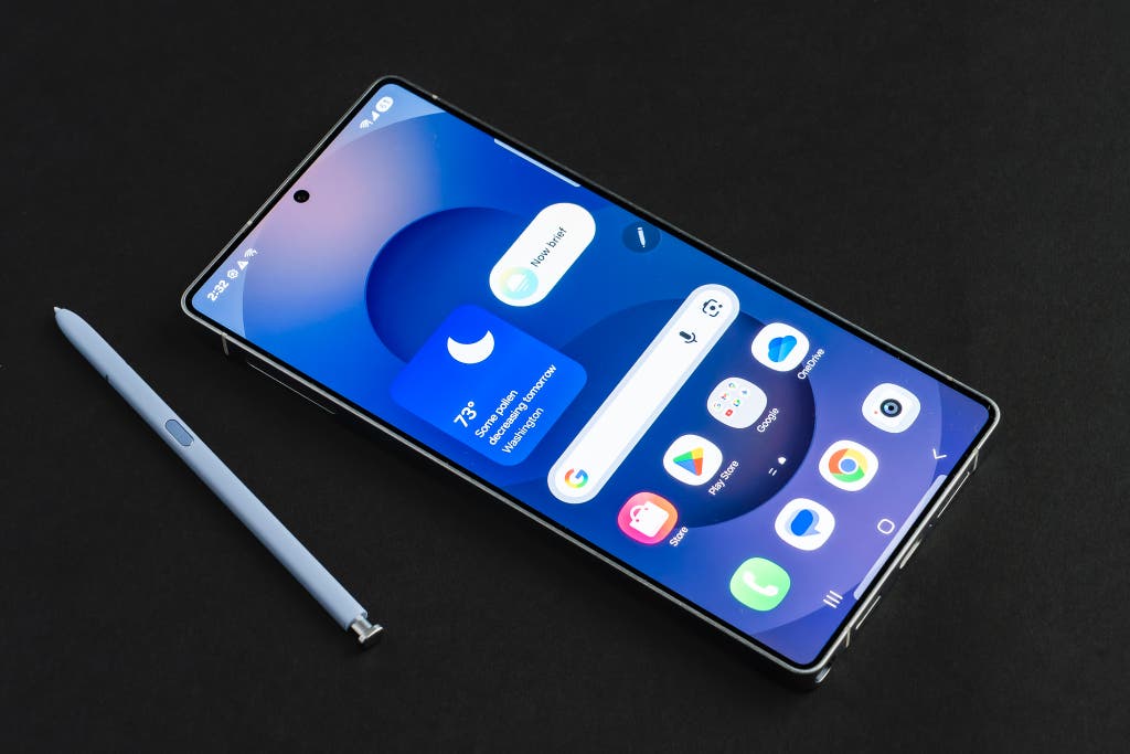 Samsung Galaxy S25 Ultra shown with its S Pen stylus resting beside it.
