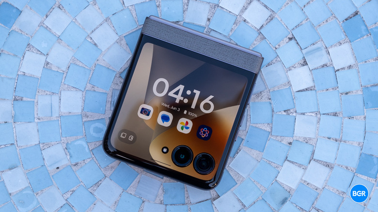The Motorola Razr 2026 resting unfolded on a flat table surface.