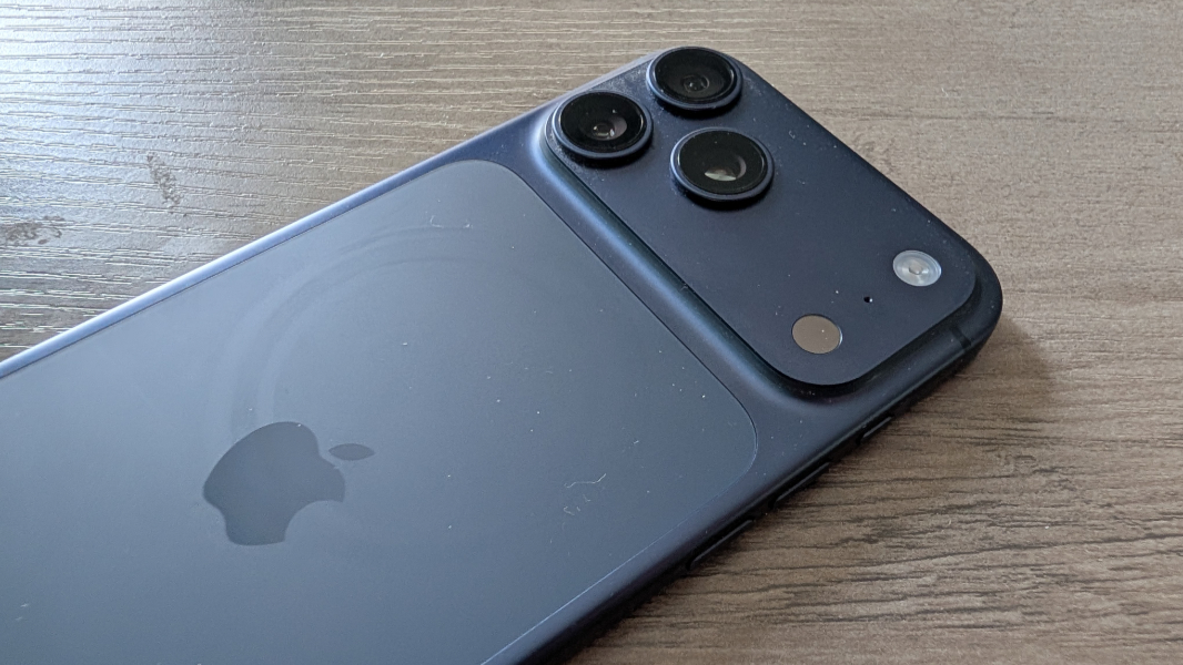 Close-up of the triple-lens rear camera system on the iPhone 17 Pro Max showing the new housing layout.