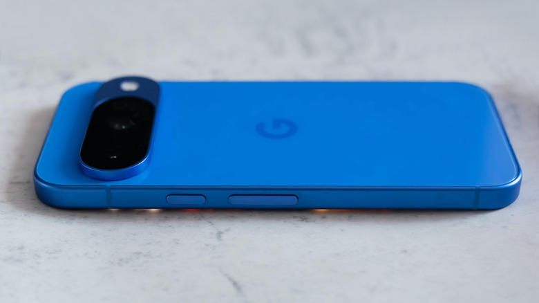 Side profile of the Google Pixel 10 resting on its frame.