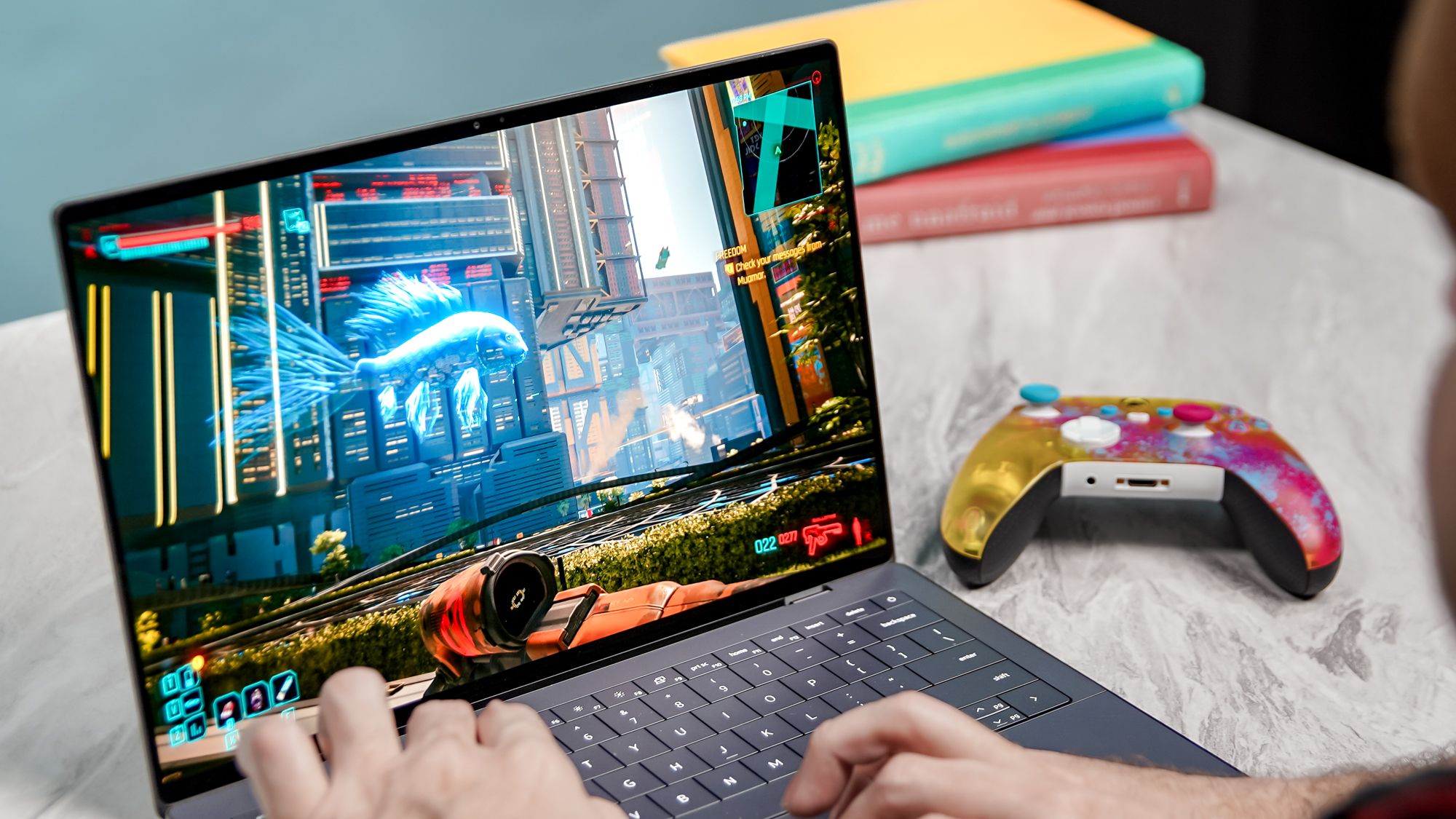A Dell XPS 14 laptop running the game Cyberpunk 2077 with smooth frame rates.