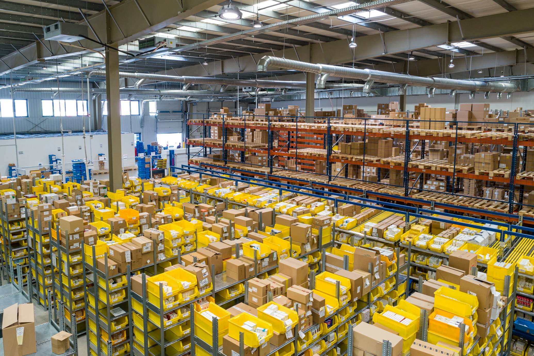 Interior view of a massive, efficient logistics and distribution warehouse.
