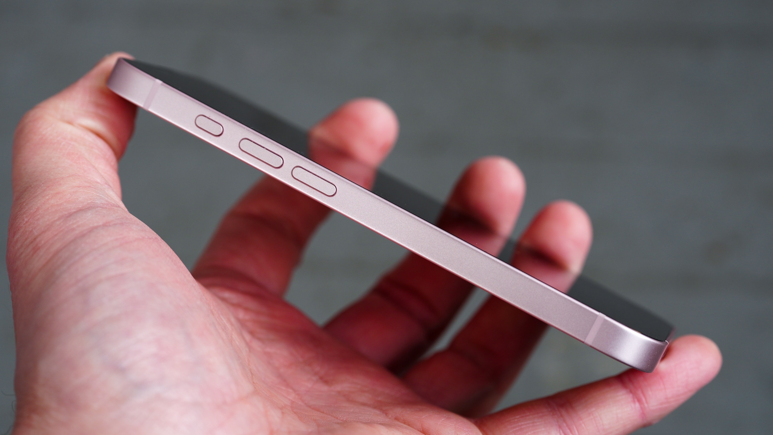 Side profile of the iPhone 17e highlighting the programmable Action Button.