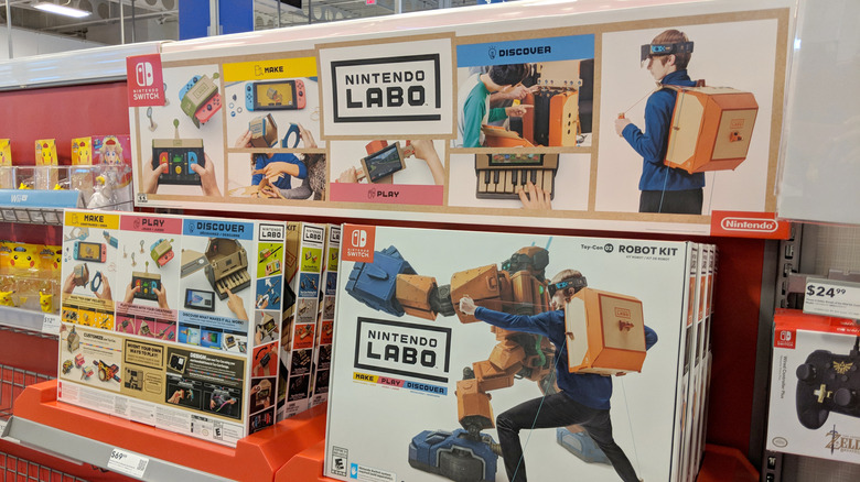 A retail display featuring various Nintendo Labo cardboard construction kits.