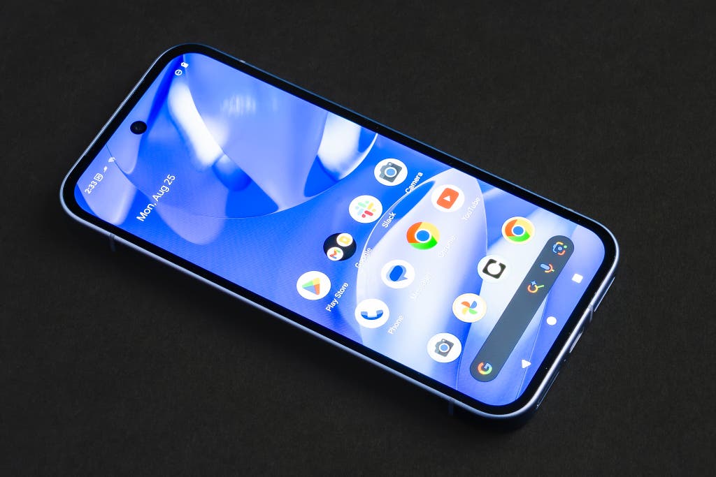 Front view of a Pixel a-series smartphone with a vibrant digital wallpaper.