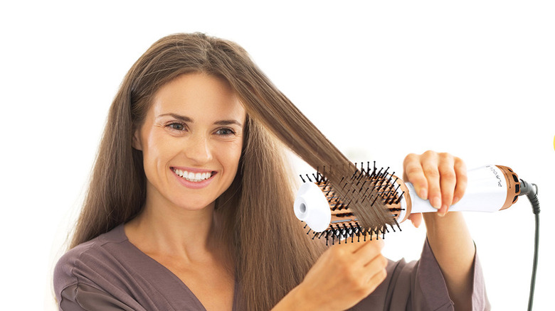 Plavogue dual voltage hair dryer brush with specialized bristles for smoothing.