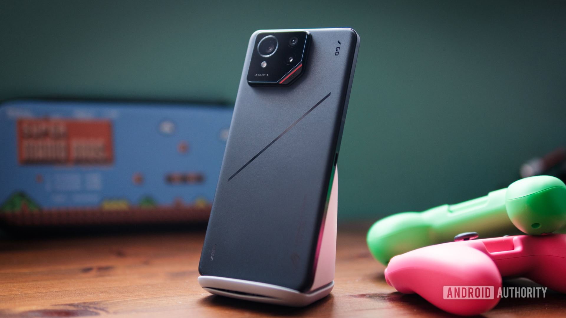 The Asus ROG Phone 9 Pro with its AeroActive Cooler accessory attached to the back.