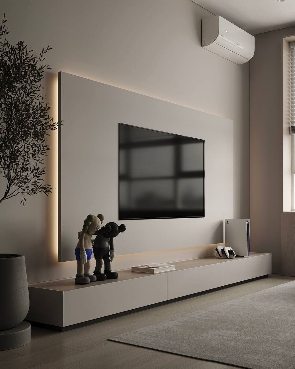 A modern, minimalist living room featuring a large smart TV mounted on a clean wall.