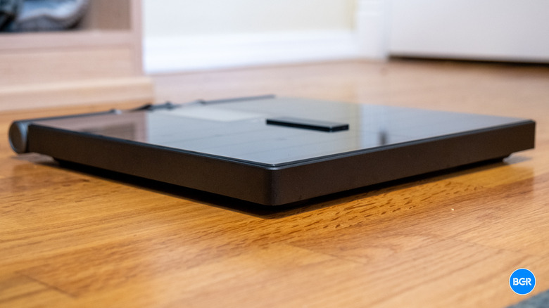 Side profile view of the Wyze Scale Ultra BodyScan showing its thickness and glass top.